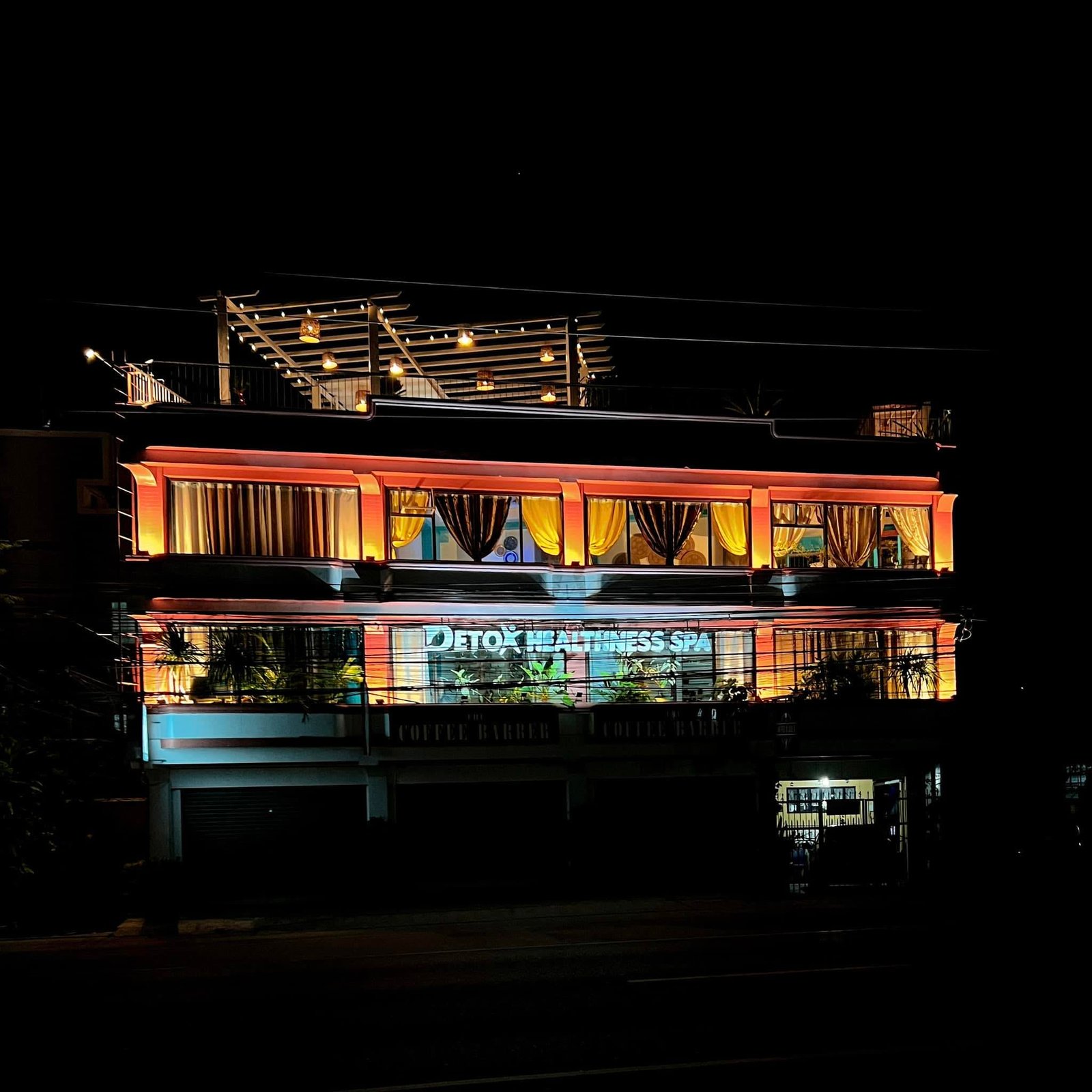 Detox Healthness Spa and Gym multi-story modern facility at night in San Fernando City